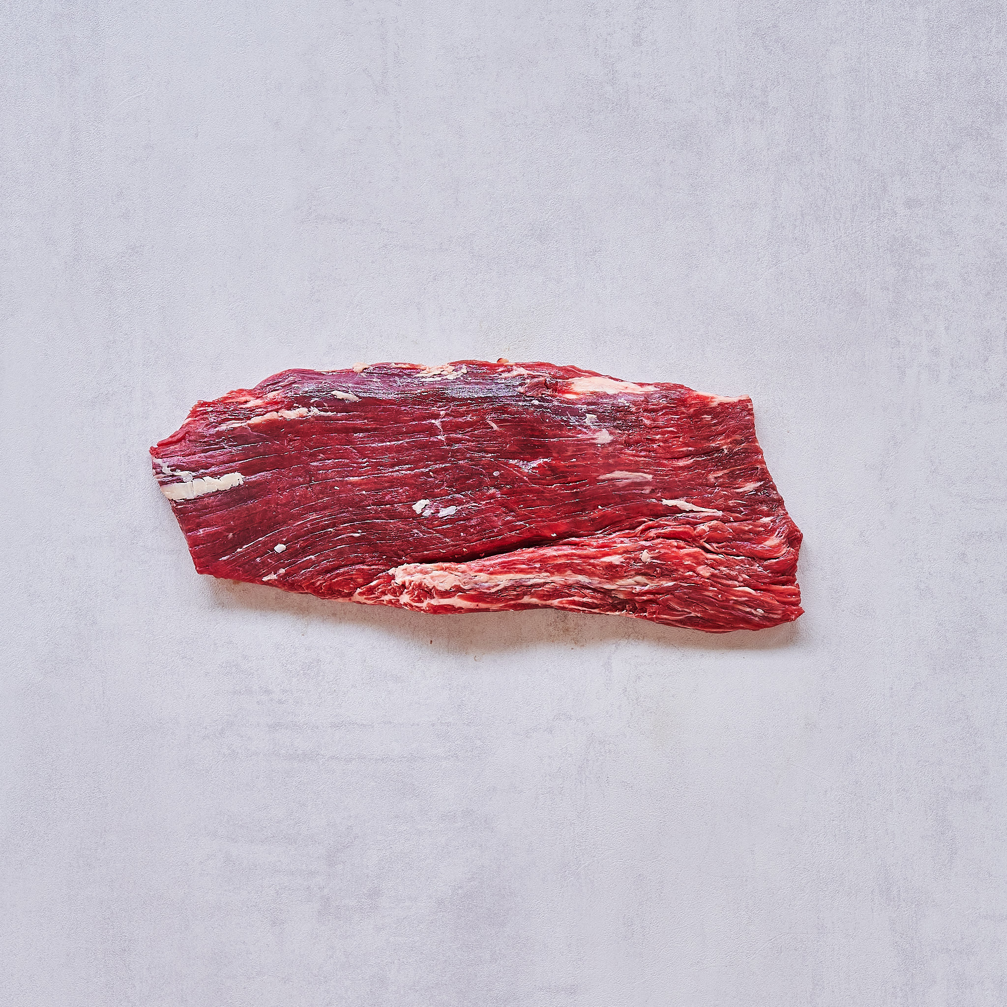 Dry Aged Flanksteak Cut auf weissem Hintergrund Dry Aged Flanksteak Cut auf weissem Hintergrund