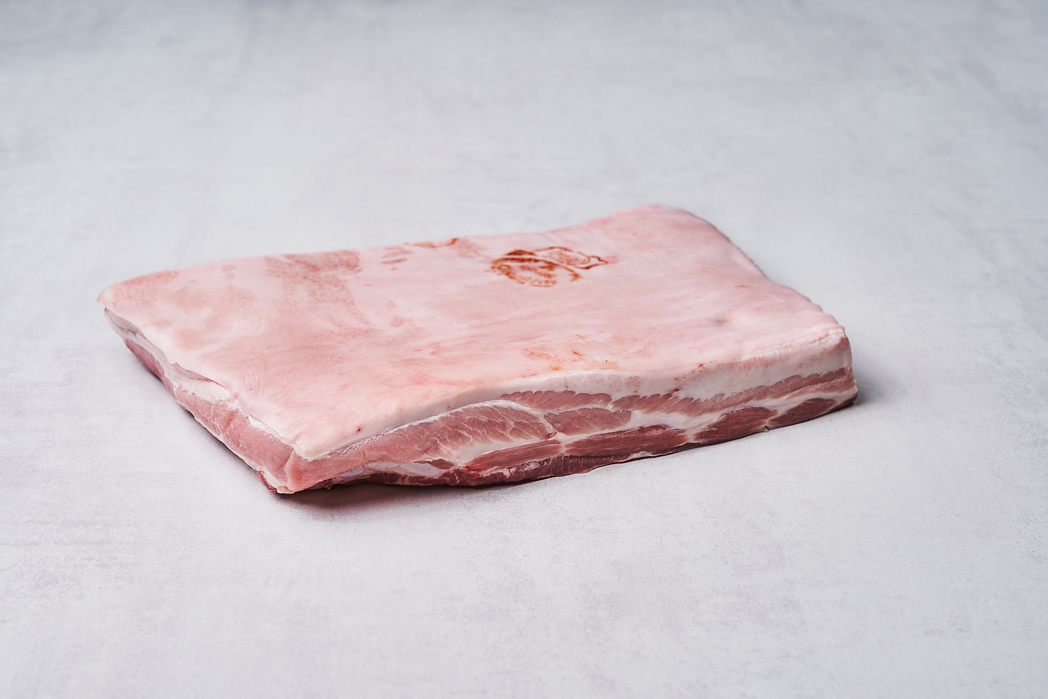 Schweinebauch vom Strohschwein Schweinebauch vom Strohschwein Produktfotografie